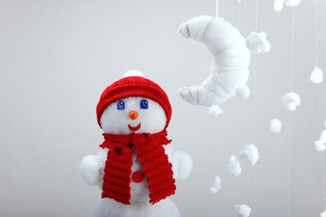 The snowman, artificial moon and snowflakes