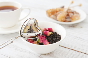 Tea strainer and rose buds
