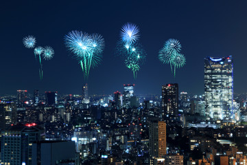 Fireworks celebrating over Tokyo cityscape at night