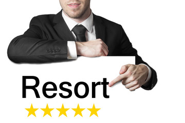 businessman pointing on sign resort five stars