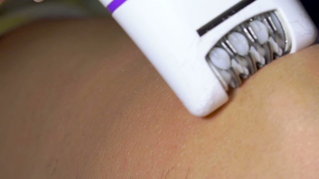 Beautician / esthetician doing depilation