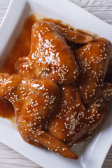 Chinese chicken wings with honey, soy sauce and sesame top view