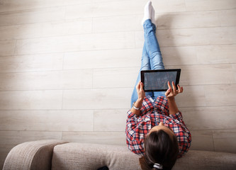 Young couple using tablet.Relaxing.