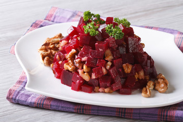 Beetroot salad with walnuts close-up horizontal