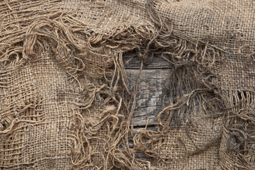 background of burlap with a hole for writing text. texture of th