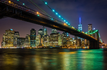 Fototapeta na wymiar The Brooklyn Bridge and Manhattan Skyline at night seen from Bro