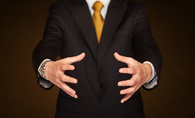 Obraz premium Businessman holding something