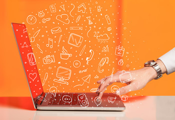 Laptop computer wtih hand drawn icons and symbols