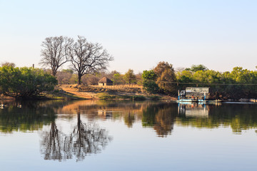 Obraz premium Car ferry on the river in morning light