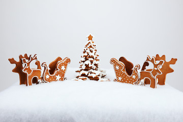 The hand-made eatable reindeer and cart with snow decoration