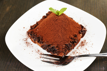 Yummy chocolate cupcake on table