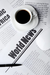 On-line news concept. Computer mouse, cup of coffee and