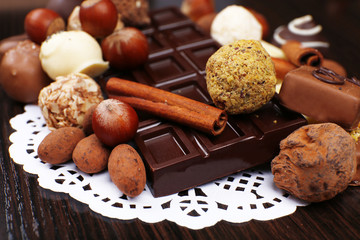 Bars of white and bitter chocolates with candies, hazelnut and