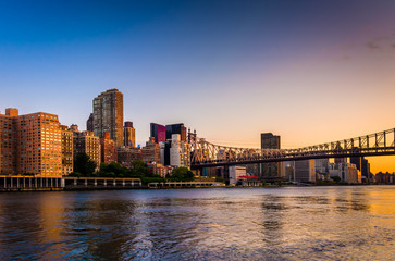 The Queensboro Bridge and Manhattan skyline at sunrise, seen fro
