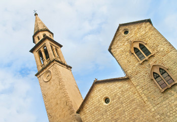 Fototapeta na wymiar medieval church with clock tower