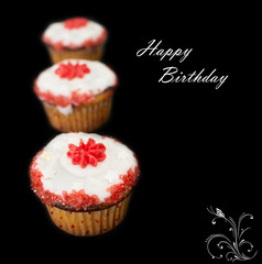 Happy Birthday cupcakes against dark background