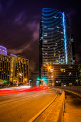 Fototapeta na wymiar Traffic on Brickell Avenue at night, in downtown Miami, Florida.