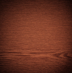 braune Holzmaserung mit Vignette.
