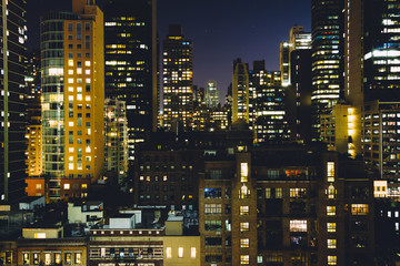 View of buildings in the Turtle Bay neighborhood at night, from