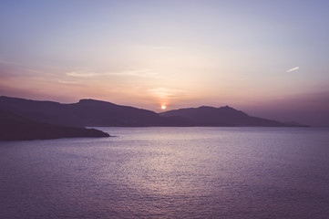 Sunset over the sea and mountains