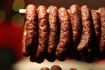 Smoked sausages meat hanging