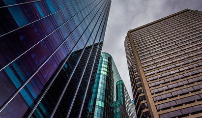 Looking up at modern buildings under a cloudy sky in Philadelphi