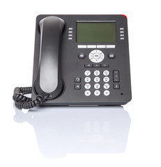 Modern desktop telephone over white background 