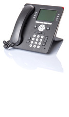 Modern desktop telephone over white background 