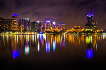 The skyline reflecting in Lake Eola at night, Orlando, Florida.