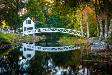 Bridge over a pond and the Selectmen's Building in Somesville, M