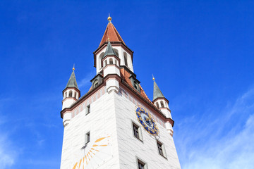 Fototapeta na wymiar Historic bell tower with sundial in Munich