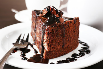 Yummy chocolate cake served on table, close-up
