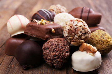 Pile of chocolate candy on wooden rustic background