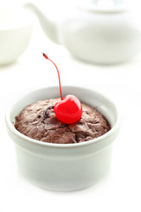 Hot chocolate pudding with fondant centre on white table
