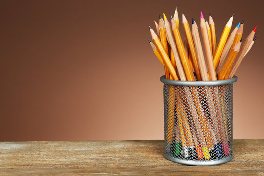 Many pencils in metal holder