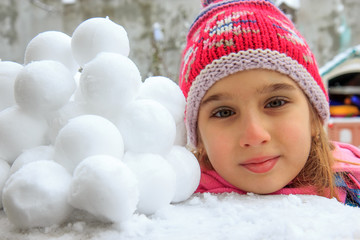 Girl and snowballs