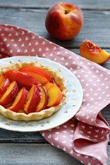 Homemade tart with slices of peach