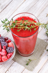 Frozen summer berries smoothie with thyme