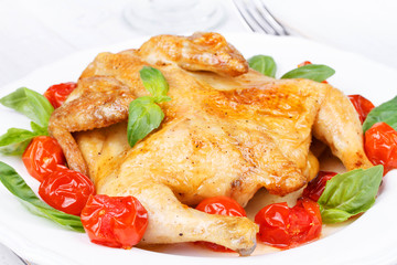Roast chicken with tomatoes cherry, green basil and garlic