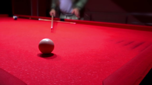 Young man playing billiard