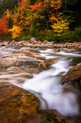 Autumn color and cascades on the Swift River, along the Kancamag