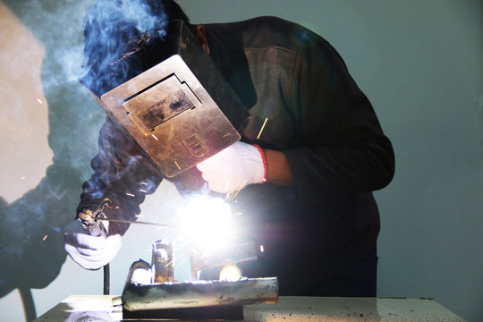 worker welding steel .