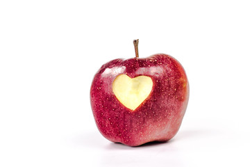 Fototapeta na wymiar isolated apple with carved heart