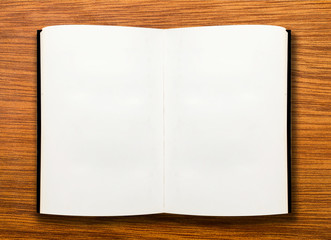 open book on wooden table