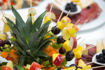 Fototapeta premium Healthy fresh fruits on a stick
