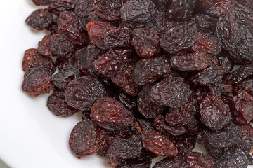 Raisins on a white plate