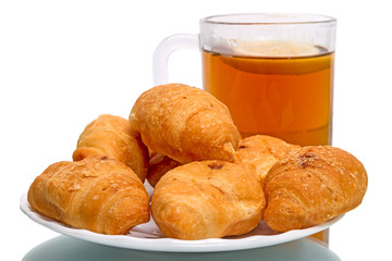 Tea with lemon and croissants