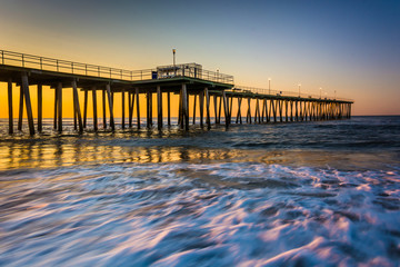 Fishing pier and waves on the Atlantic Ocean at sunrise in Ventn