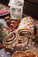 christmas poppy seed cake with icing and snowflake sprinkles