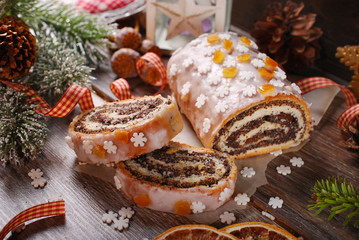 christmas poppy seed cake with icing and snowflake sprinkles
